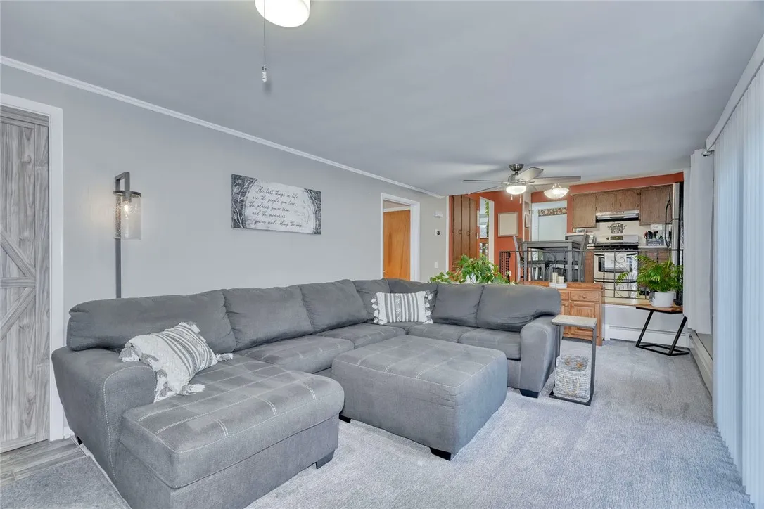 Family room with ceiling fan and slider to the back patio