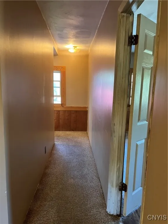 Hall leads to side entry