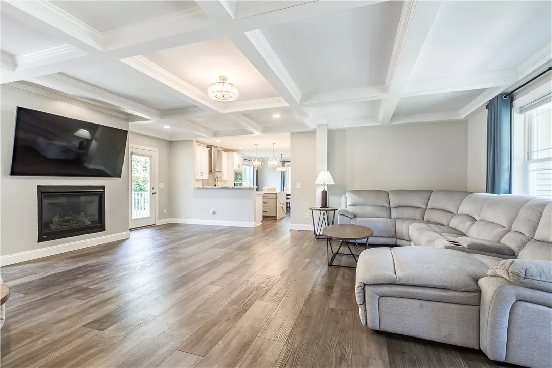 ENTERTAINMENT SIZED GREAT ROOM WITH BEAM CEILINGS WITH CROWN MOLDING, GAS FIREPLACE