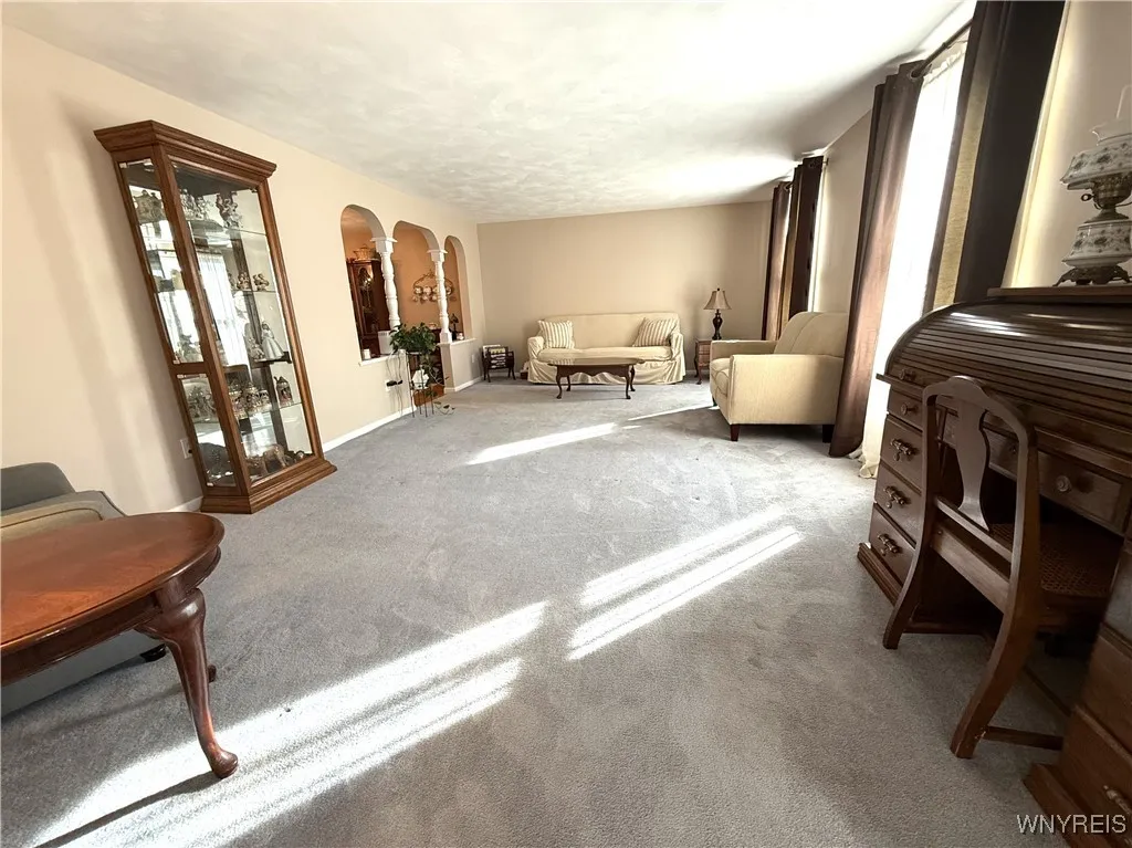 Living Room has HW floors under the carpeting.