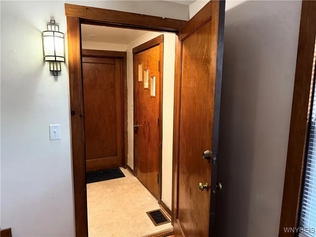 Foyer with the door leading to the front on the right and your close neighbor's door straight ahead.