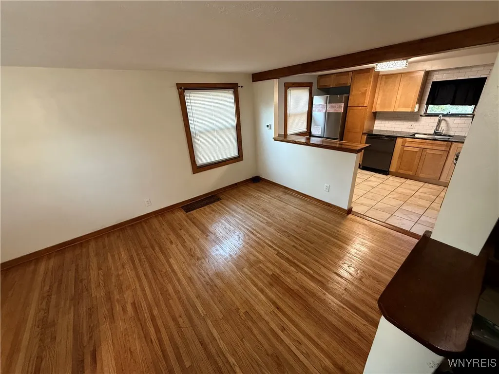 Let's head toward the kitchen so we can see the basement.