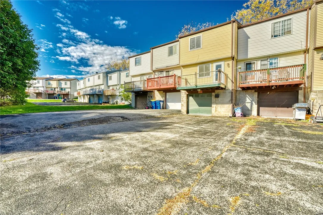 REAR PARKING LOT - DRIVE-IN BASEMENT GARAGE