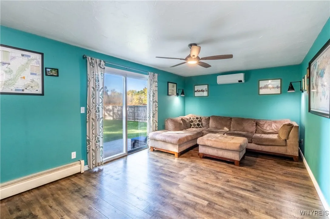 The family room features a sliding glass door that opens to the back patio and fully fenced yard.