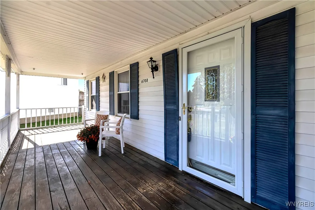 Covered front porch with pretty front entry doors