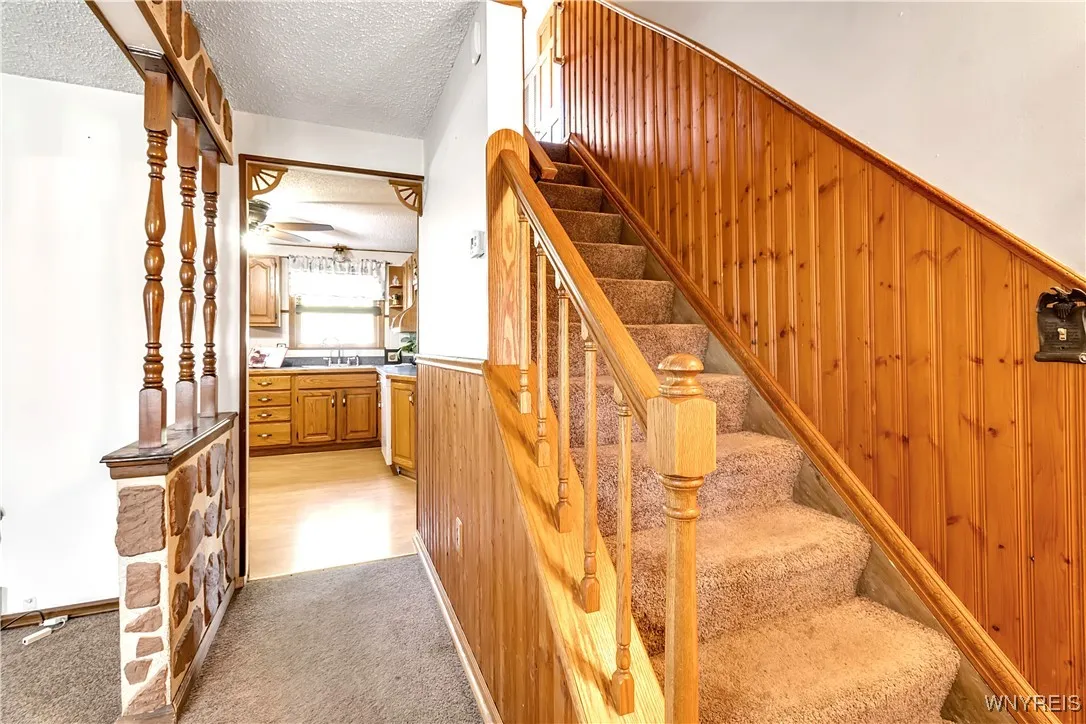 Carpeted stairs to 2nd floor