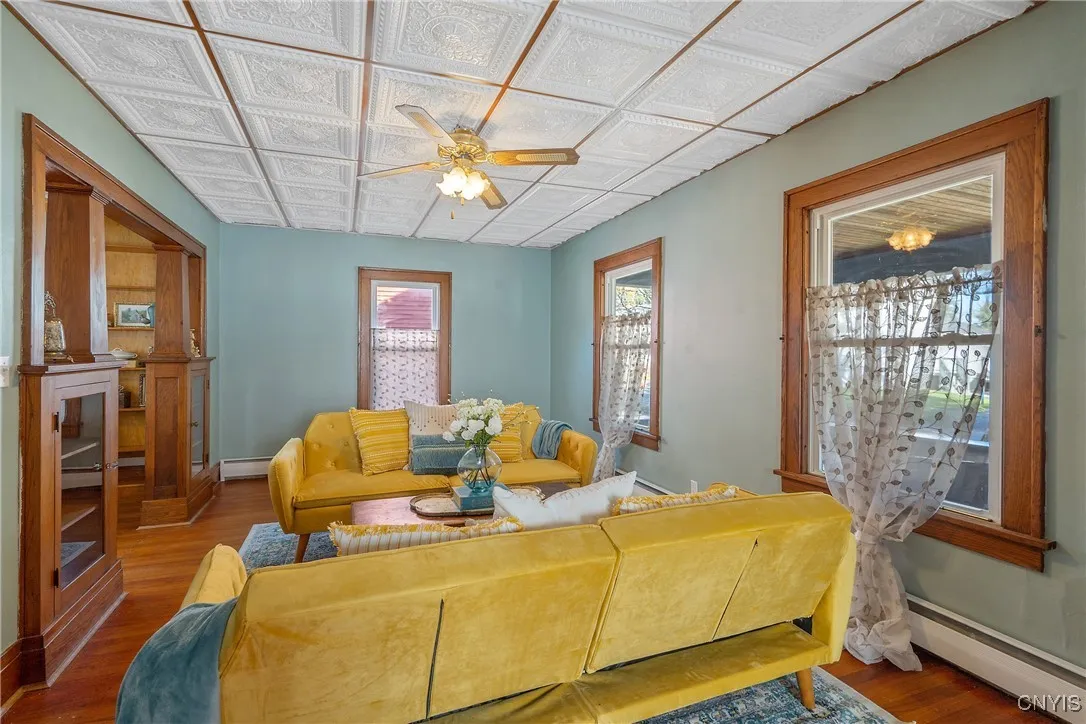 Entering the living room you will find a striking coffered ceiling that adds depth and dimension to the room, and creates authenticity to the space.