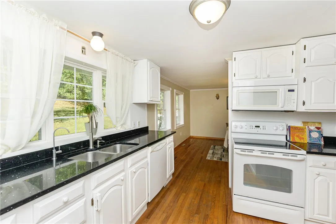 L Shaped Galley Kitchen with gorgeous granite countertops