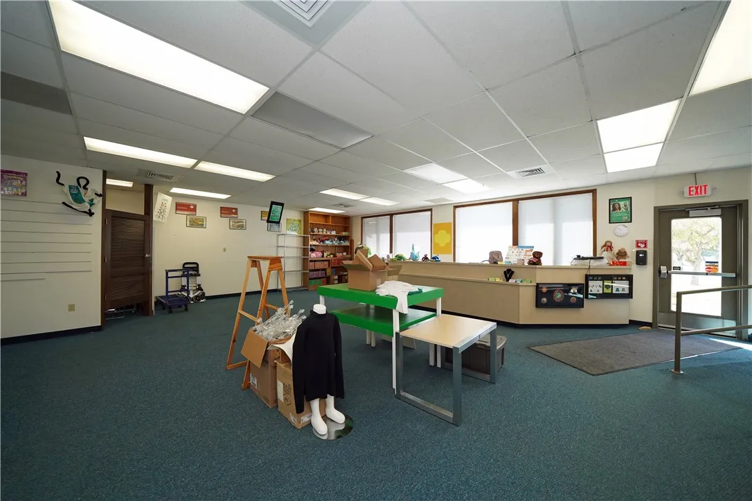 Large Open Room with its own exterior entrance and lockable interior door.  Has been used as a store.  Could be additional offices!