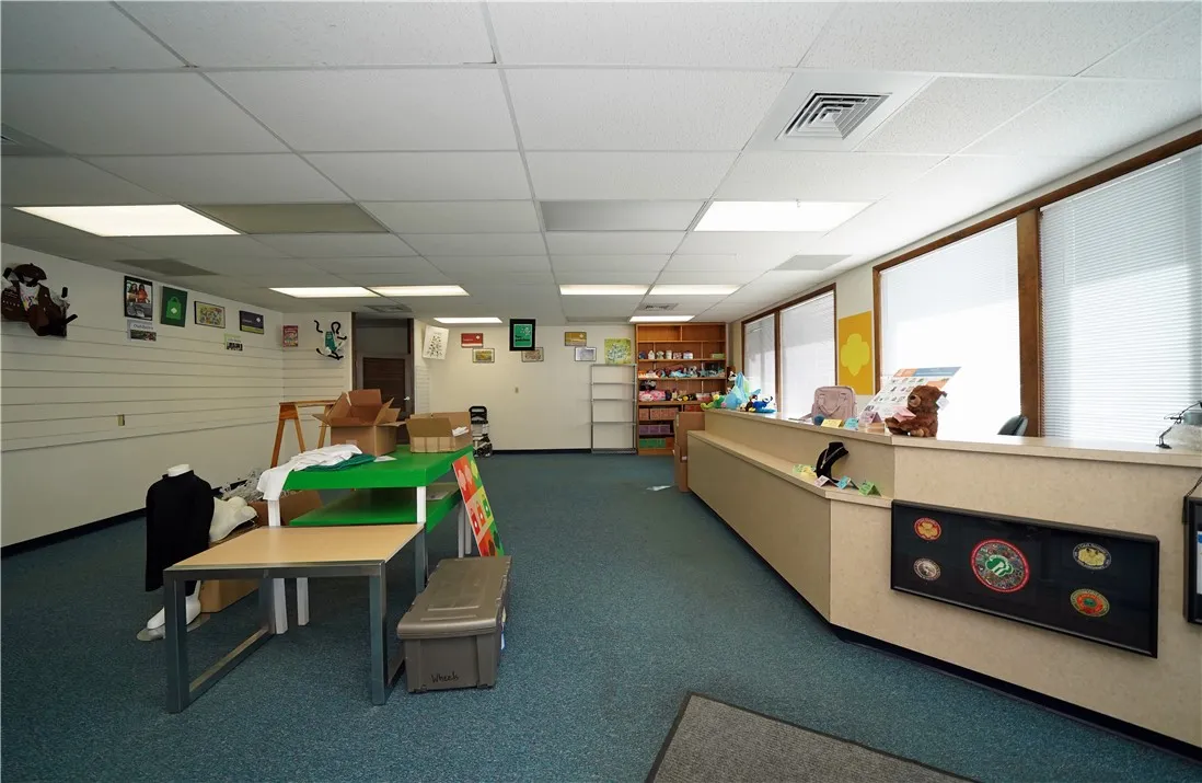 Large Open Room with its own exterior entrance and lockable interior door.  Has been used as a store.  Could be additional offices!
