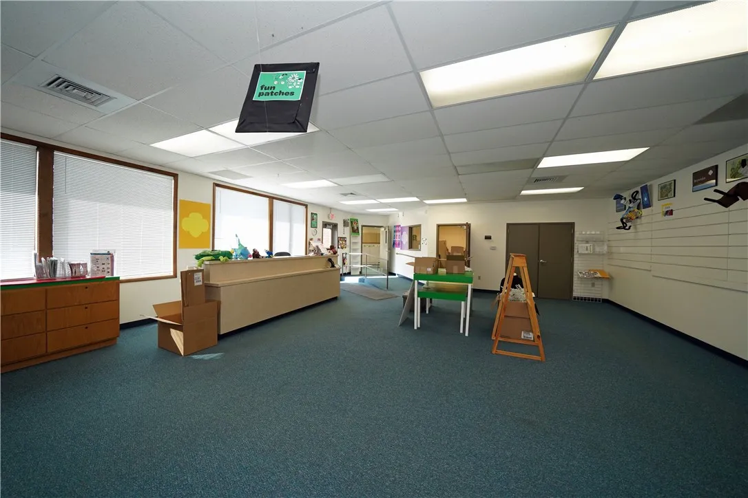 Large Open Room with its own exterior entrance and lockable interior door.  Has been used as a store.  Could be additional offices!