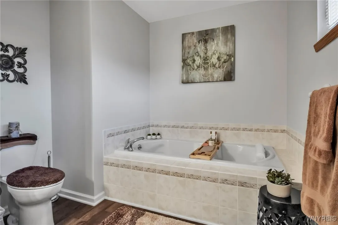 Primary bath luxury plank vinyl floor