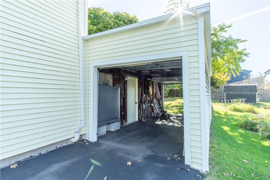 Attached Garage with opening on front and back
