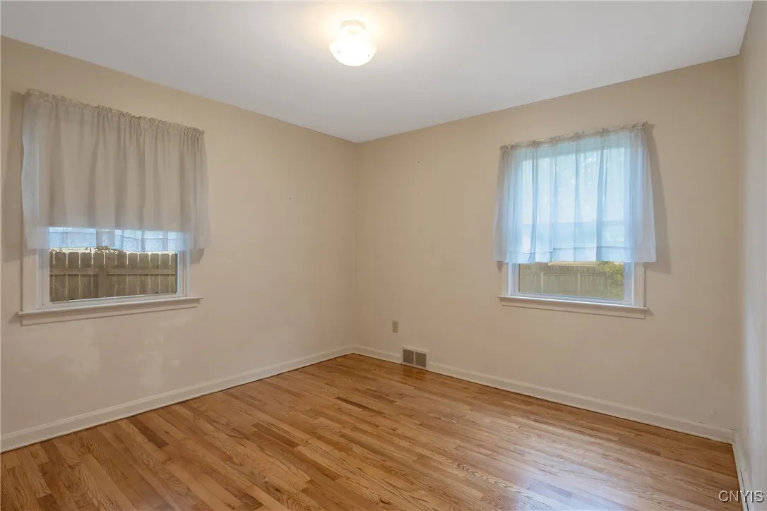 Back first floor bedroom with recently refinished hardwood floors