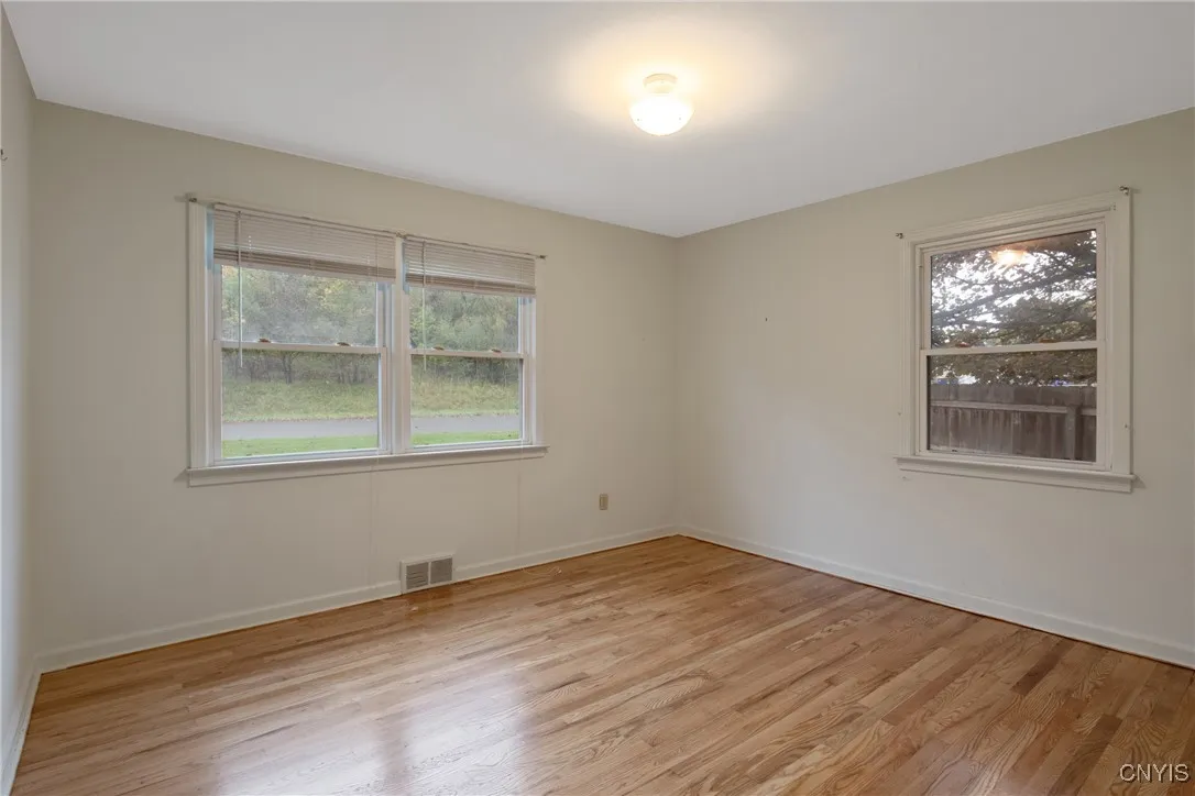 Front first floor bedroom with recently refinished hardwood flooring