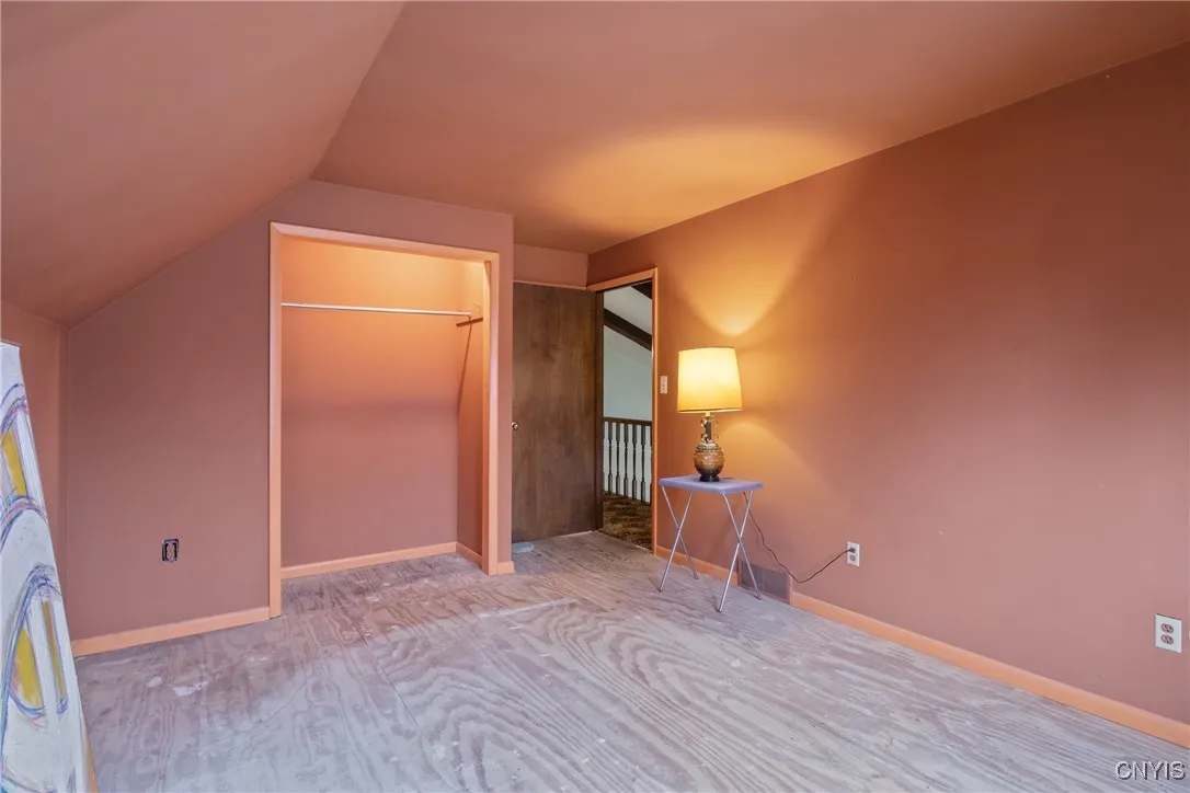 Good sized closet with light and pocket door to bathroom just behind door.