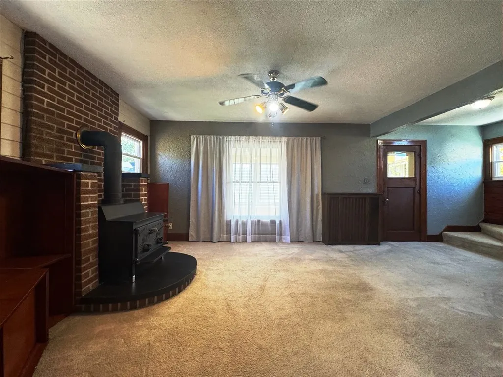 Living room with woodstove and built-ins