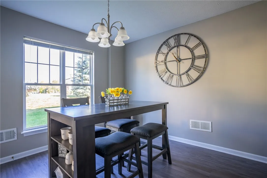 Spacious dining area with door to private patio (door is to the left, out of the frame of the image)