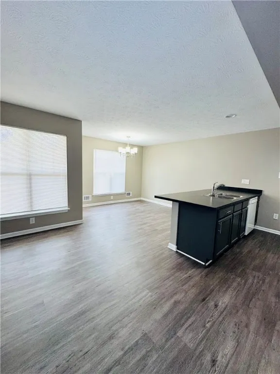 Typical great room of a 3-bedroom, 2.5-bathroom townhome (countertop & cupboard colors may vary)