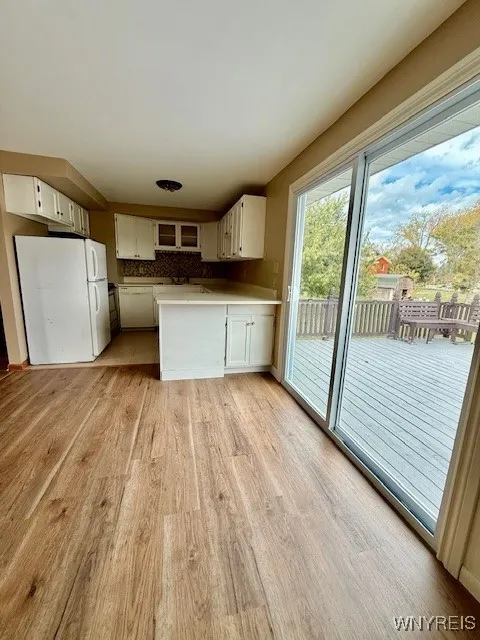 View from dining area into kitchen and deck.