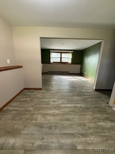 Lower unit open floor plan, view of living room from dining area

