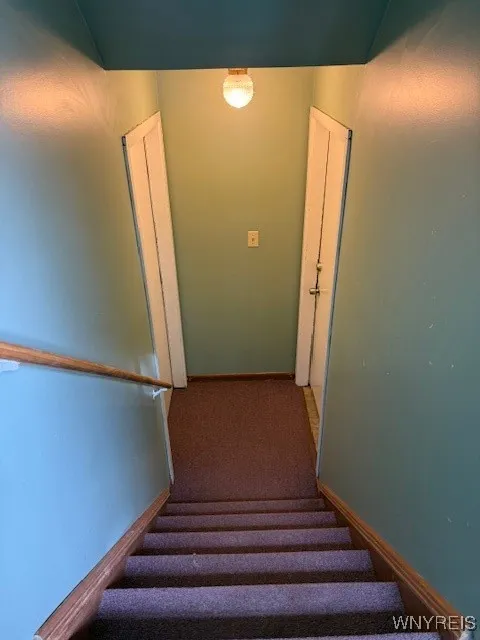 Entry to lower unit on the right. Utility room on the left.
