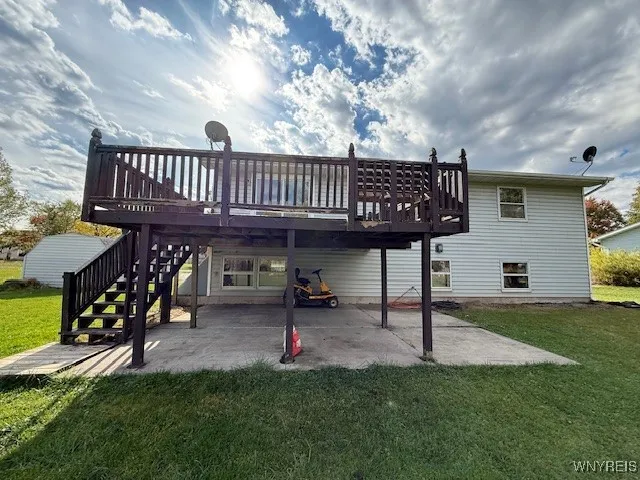 Covered cement patio under the upper deck
