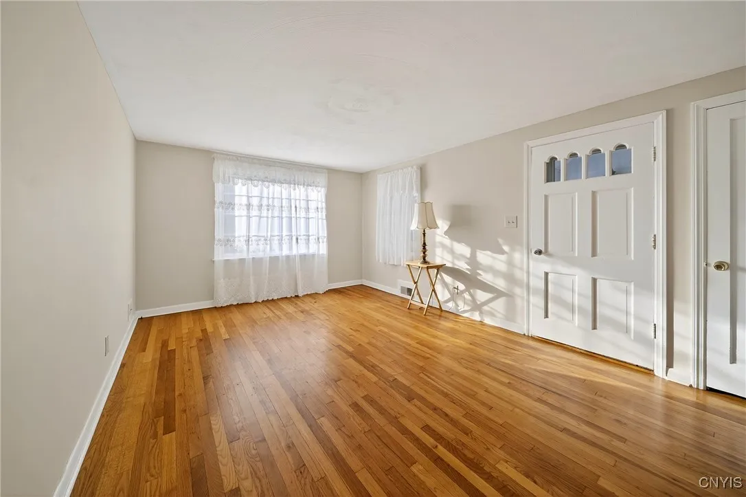 Walk into the front living room with beautiful hardwood floors.