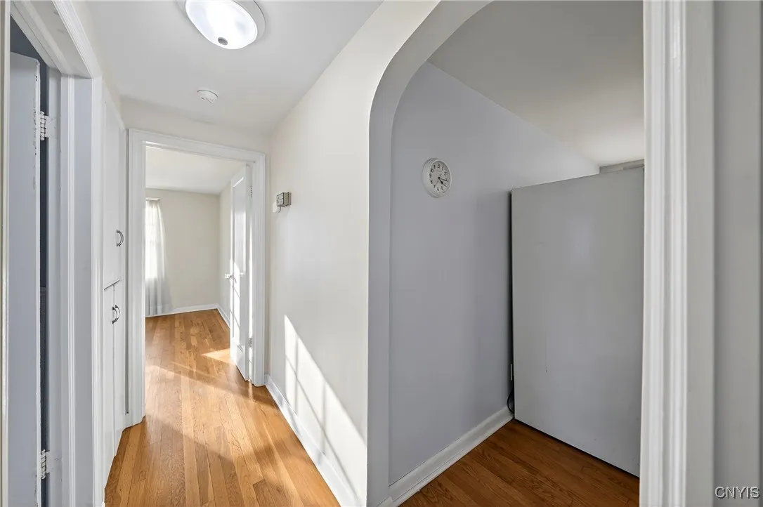 Hallway that leads to the full bath and two bedrooms.