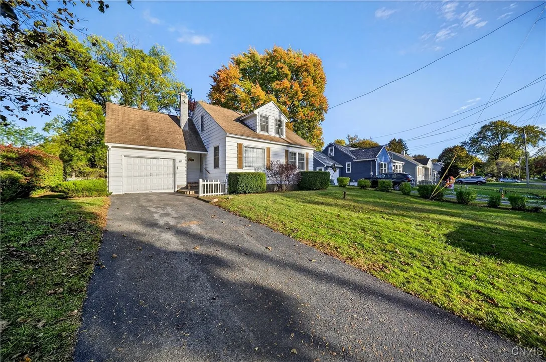 Front/side view of home & driveway. 2-3 cars can fit in the drive