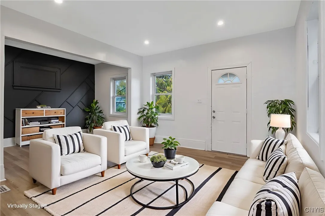 Entry way leads into a large living room with a bonus space to the right.