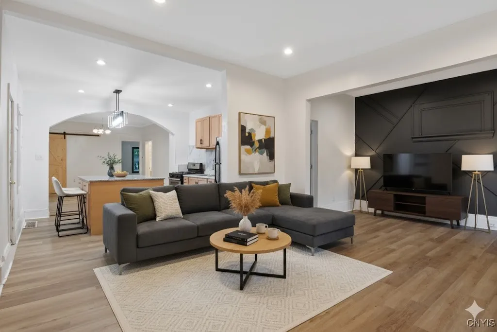 Open Floor plan flows seamlessly from living room to kitchen to dining room beyond.