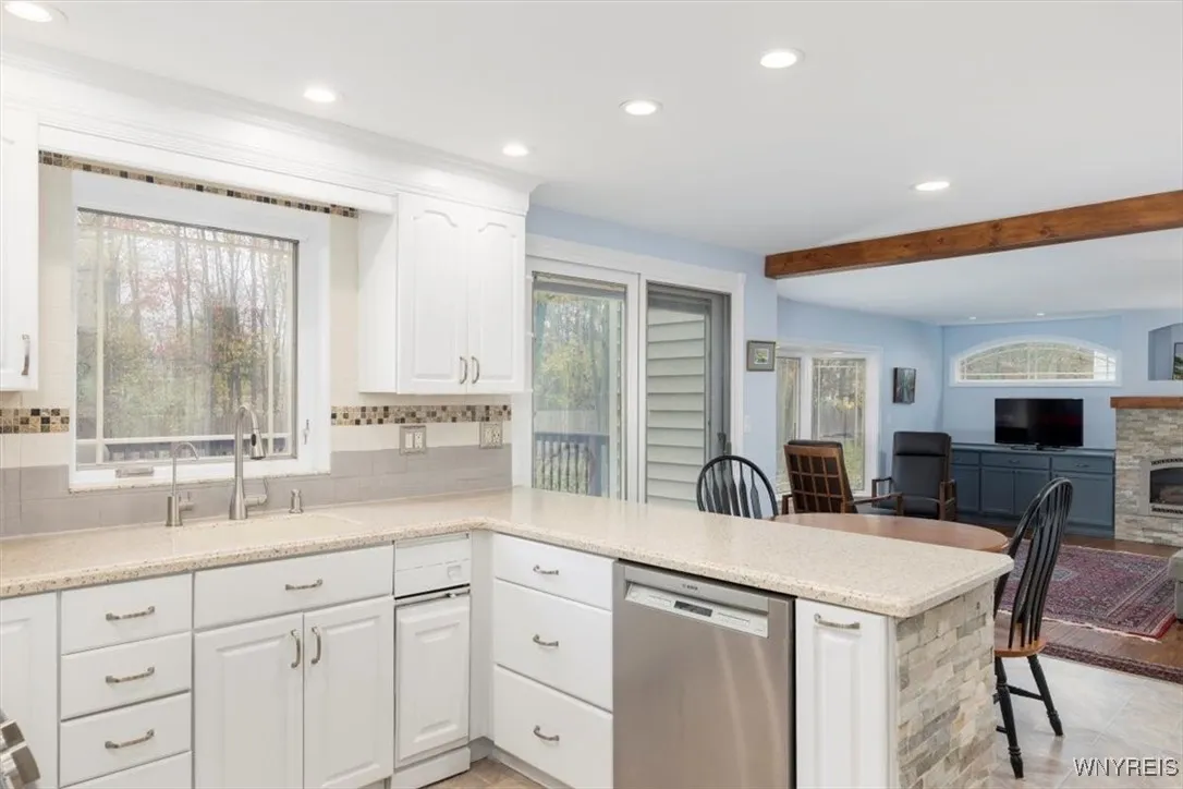 Stunning eat-in kitchen, solid surface counter, 2 pantries and tons of counter space