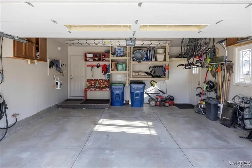 Large freshly painted garage with storage