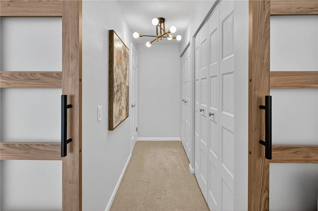 DOOR AT THE BACK LEFT LEADS TO OUTSIDE THE BATHROOM AREA