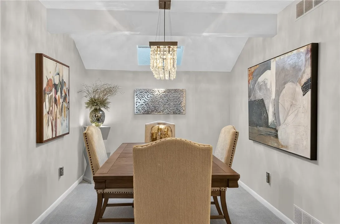 FORMAL DINING AREA W/ SKYLIGHT. COULD EASILY BE CLOSED OFF FOR A BEDROOM OR WORK FROM HOME SPACE