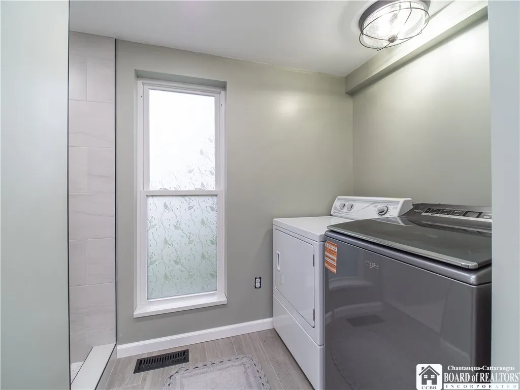 The laundry is housed on the main floor inside the full bathroom.