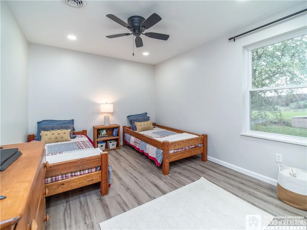 Bright and cheerful bedroom easily accommodates two twin beds, bunk beds or a queen sized bed.