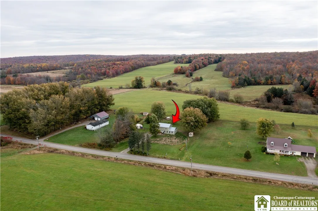 Stunning hillside vistas and open fields graciously surround the home.