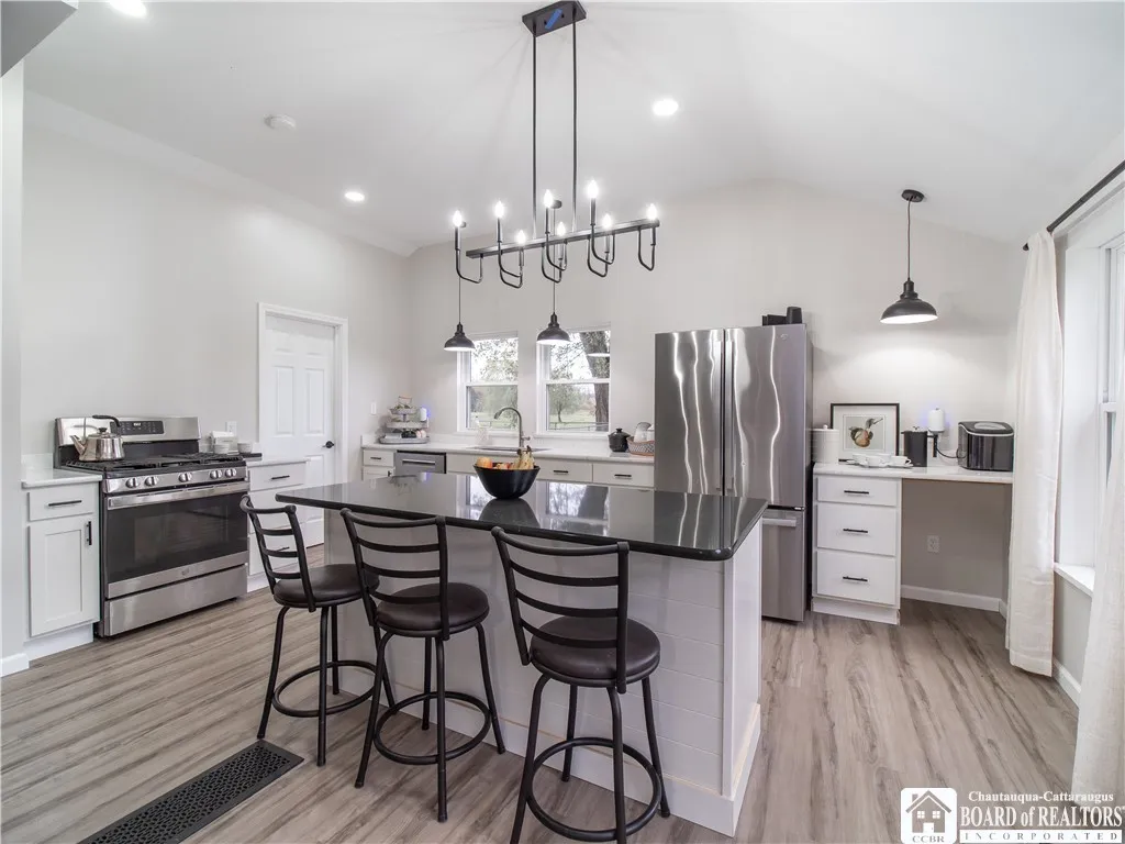 Enjoy casual dining at the kitchen island and utilize the coffee station, already outfitted to accommodate a wine fridge under the counter.