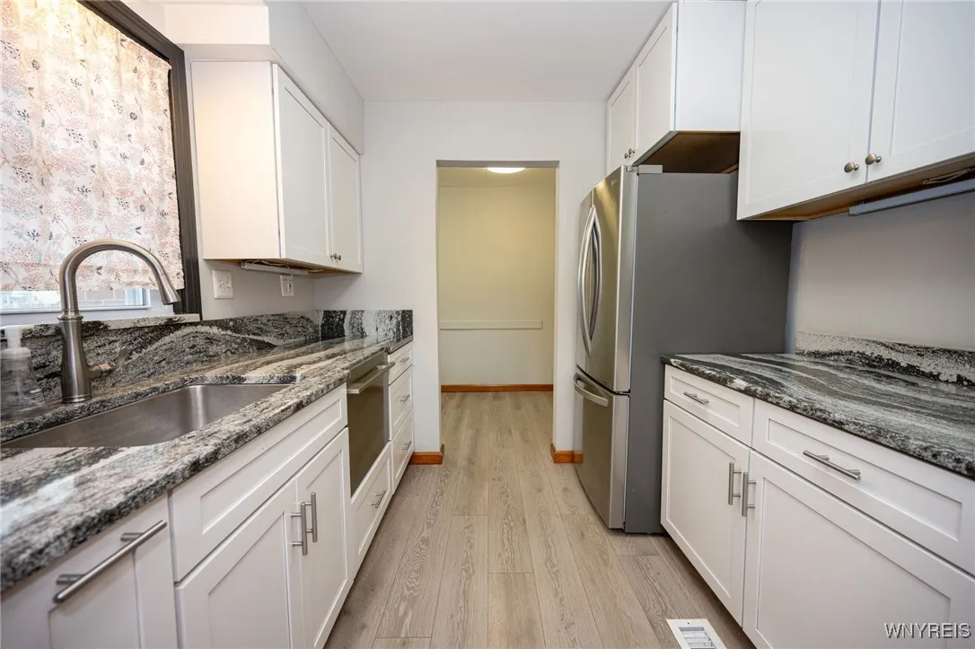 Kitchen looking into breakfast nook area