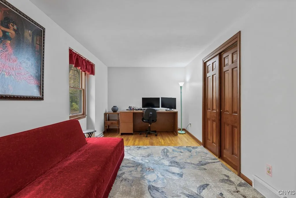 bedroom # 2 hardwood floors and very good sized, with once again solid wooden doors...