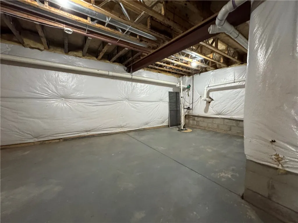 Spacious storage area in unfinished section of basement