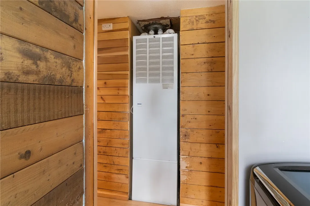 The laundry area- HVAC and a REAL WOOD ACCENT WALL