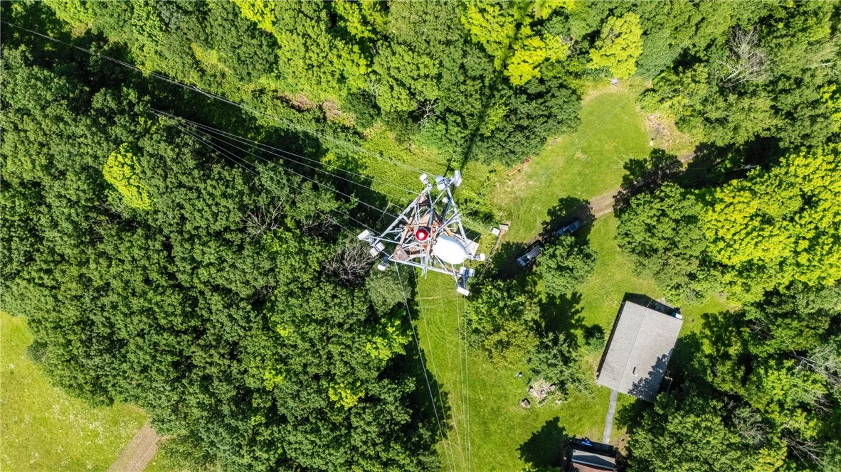 The property to the left of the road is included in the sale. The property & cabin to the Right of the road are not part of the property for sale.