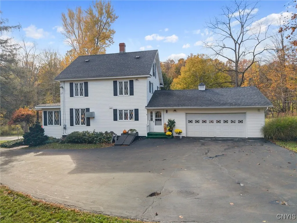 GENEROUS PAVED AREA OFFERS AMPLE PARKING.