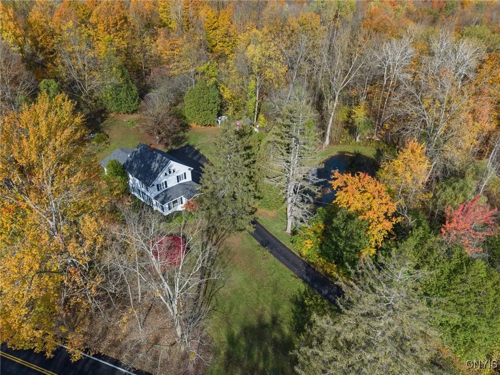 4.80 ACRES SURROUNDS THIS HOME