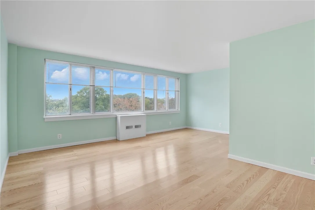   * Living room and dining room area Beautiful new floors wall of windows fill the room with an abundance of natural light and great view *
