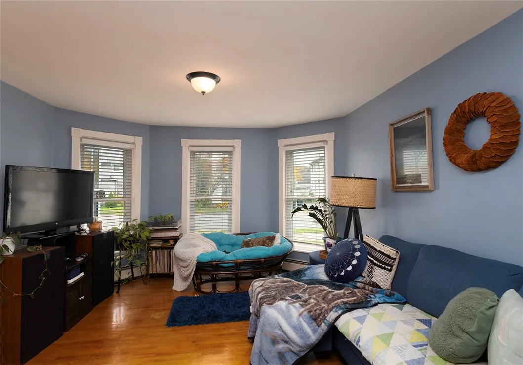 This inviting space connects seamlessly to the dining room, creating a warm flow for entertaining and everyday living.