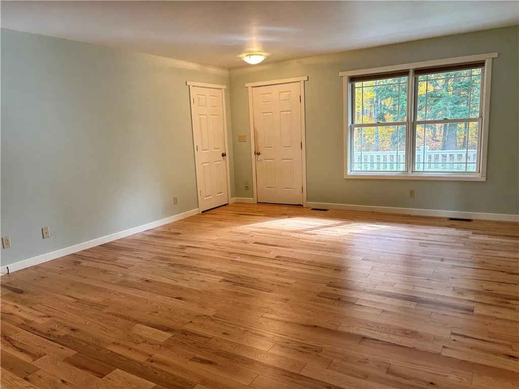 Living room with coat closet and front door
